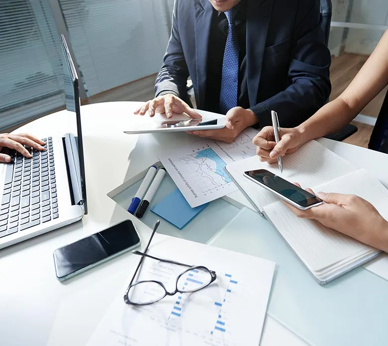 Desk with devices and office supplies